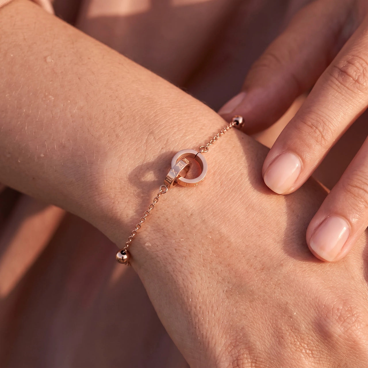 Close-up of the rose gold bracelet worn on the skin | SKU: 25535339-rose-gold