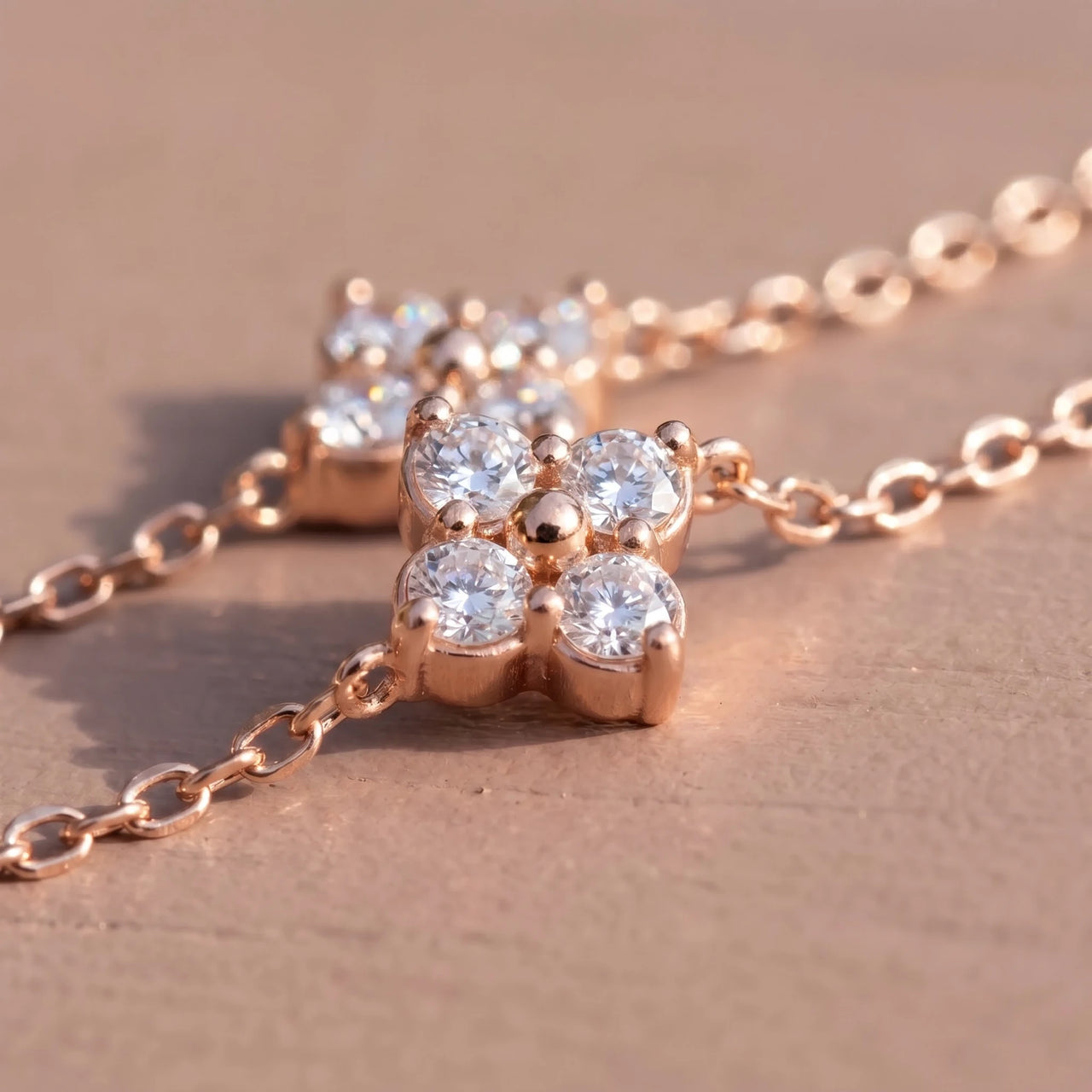 Clover Charm Anklet close-up of the gold clover charm