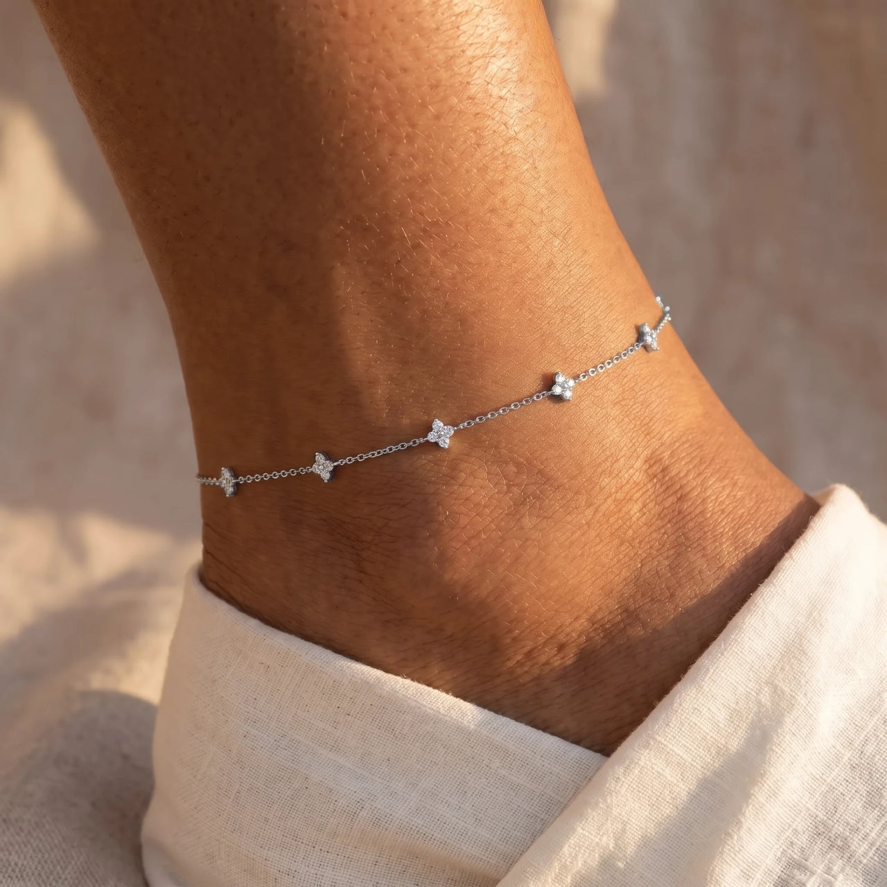 Clover Charm Anklet in Silver worn on the ankle