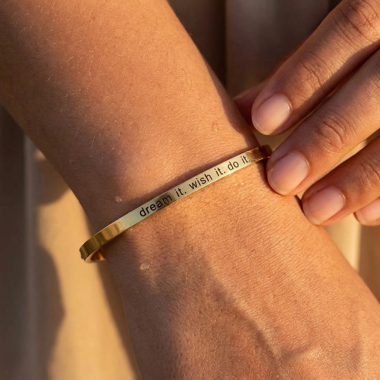 Close-up of the gold engraved cuff bracelet worn on the skin | SKU: 4214557-gold-color