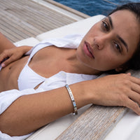 Thumbnail for Woman on a yacht wearing the silver engraved cuff bracelet | SKU: 4214557-silver-plated