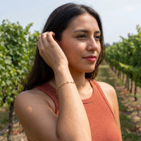 Thumbnail for Woman gently touching her Original bracelet in gold | SKU: l-original