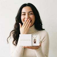 Thumbnail for The gold bar photo necklace in the Brother & Sisters gift box, held in her palm | SKU: TPH-BARN-GOLD
