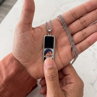 Thumbnail for Thumb warming the silver bar pendant: the hidden photo appears under the thumb while the rest stays black | SKU: TPH-BARN-SILVER