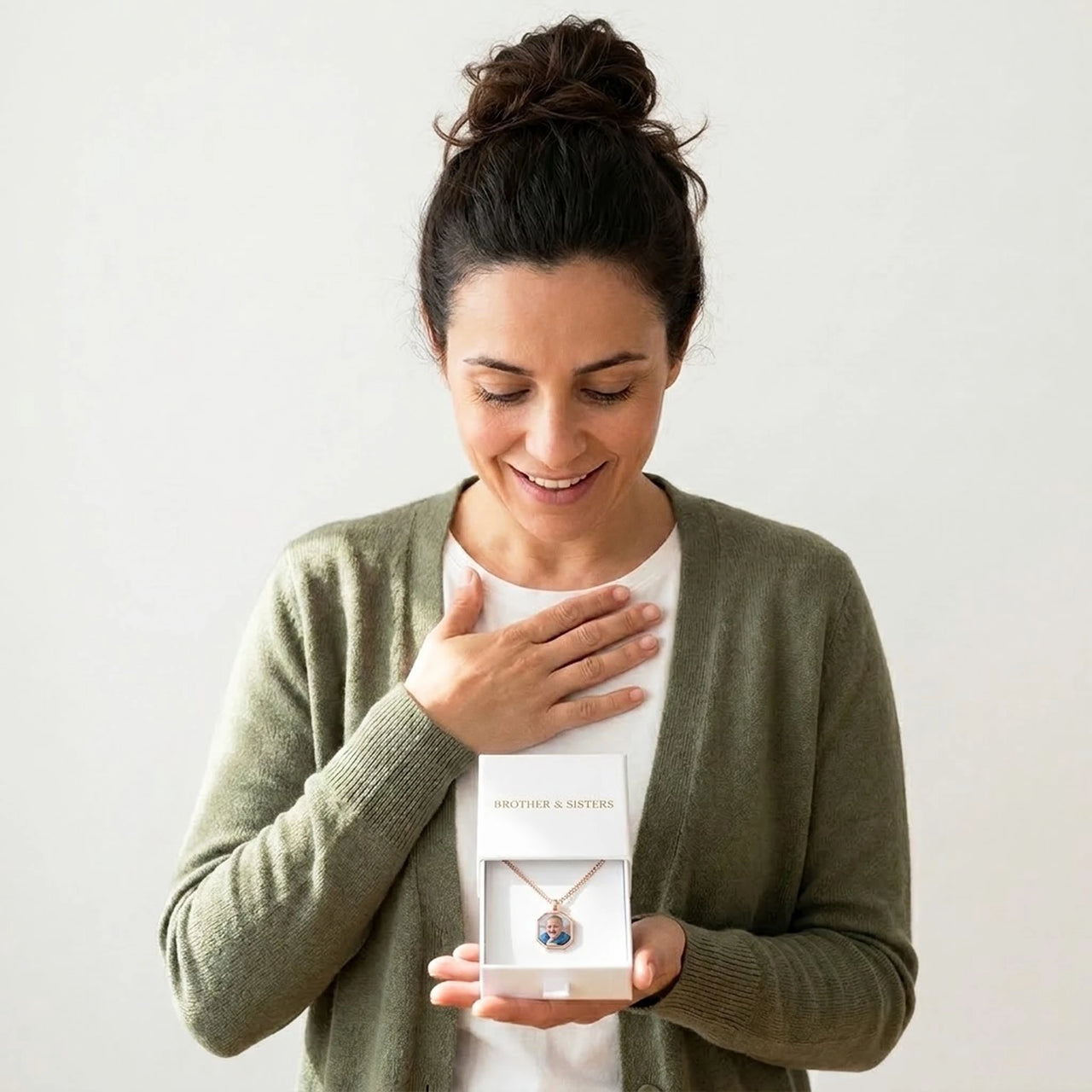 Mother discovering her baby son's photo in the rose gold octagon necklace gift box | SKU: TPH-OCTN-ROSEGOLD