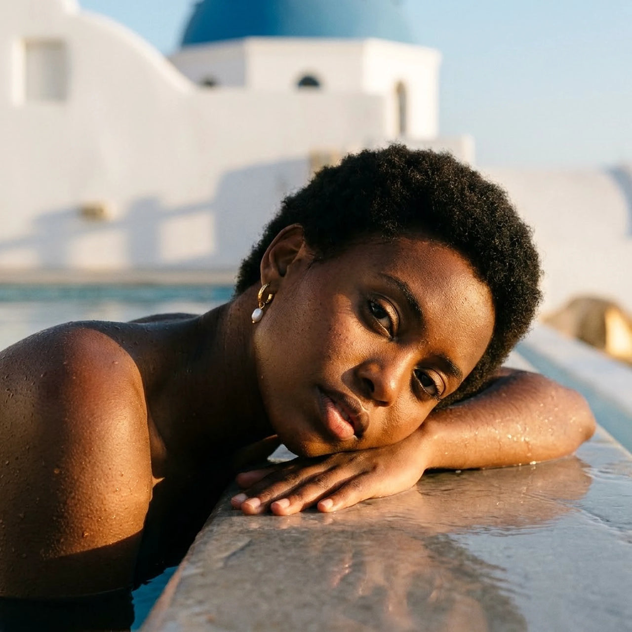 Twisted Pearl Drop Hoops in Gold, worn by a pool in Santorini | SKU: 41004-gold